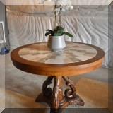 F34. Marble top round table. 30”h x 38”w 